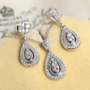 Złote kolczyki i zawieszka na łańcuszku z diamentami łącznie 0.87ct 9K